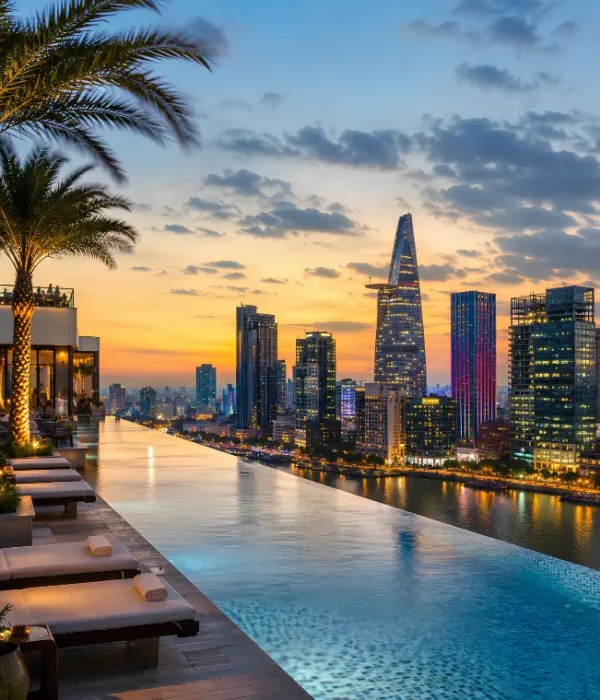 Ho Chi Minh City skyline with rooftop infinity pool, Saigon River views, luxury loungers, and modern towers at dusk.