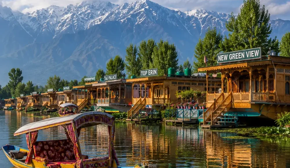 Srinagar houseboat on Dal Lake with calm water, wooden shikara, Himalayan hills and clear morning daylight.