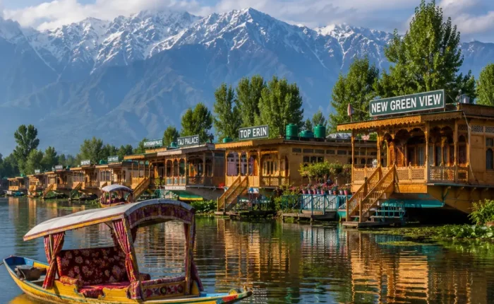 Srinagar houseboat on Dal Lake with calm water, wooden shikara, Himalayan hills and clear morning daylight.