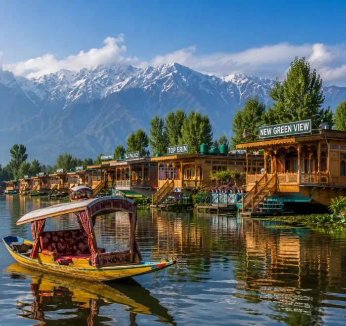 Srinagar houseboat on Dal Lake with calm water, wooden shikara, Himalayan hills and clear morning daylight.