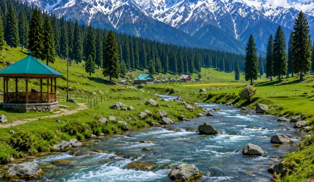 Doodhpathri Kashmir with green meadows, pine forests, flowing stream and snow-capped mountains in clear morning light.