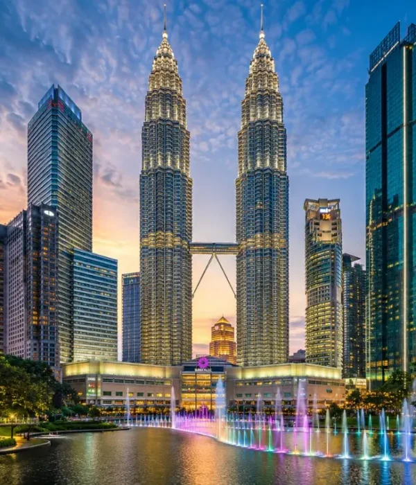 Kuala Lumpur skyline with Petronas Twin Towers, modern city buildings and clear blue daytime sky