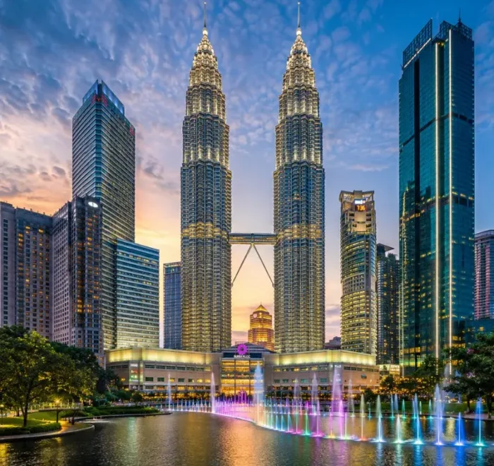 Kuala Lumpur skyline with Petronas Twin Towers, modern city buildings and clear blue daytime sky