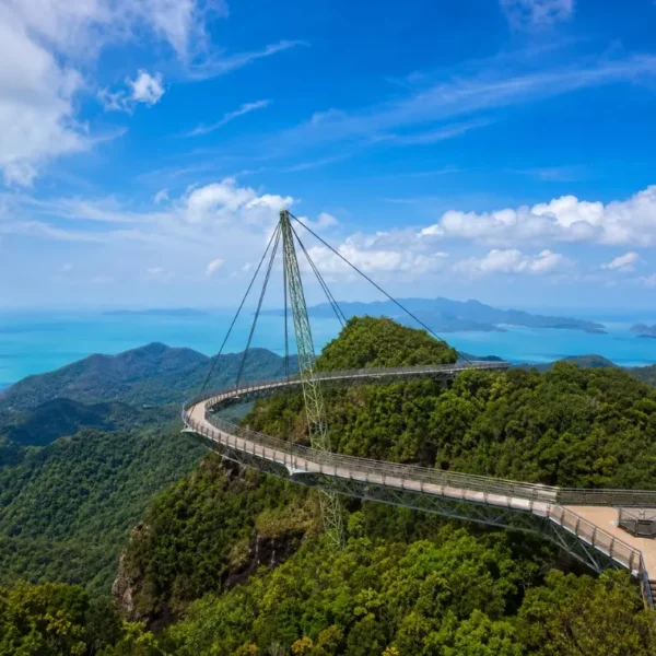 Langkawi Sky Bridge above lush rainforest with turquoise sea and island views in bright daylight