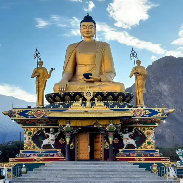 Leh Nubra Valley package with giant Buddha statue, monastery architecture and scenic Ladakh mountain landscape
