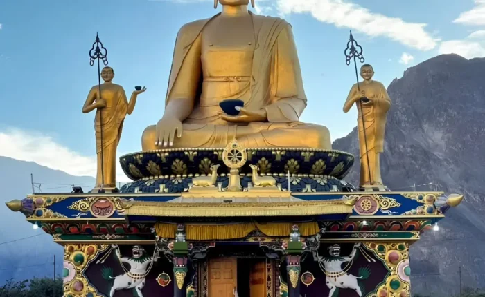 Leh Nubra Valley package with giant Buddha statue, monastery architecture and scenic Ladakh mountain landscape