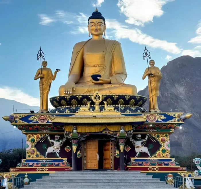 Leh Nubra Valley package with giant Buddha statue, monastery architecture and scenic Ladakh mountain landscape