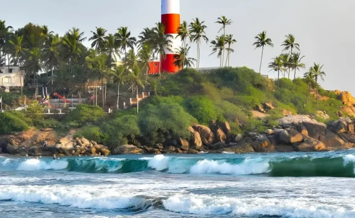 Munnar Thekkady Alleppey Kovalam package featuring Kovalam Lighthouse, palm-lined beach, sea waves and Kerala coastal beauty