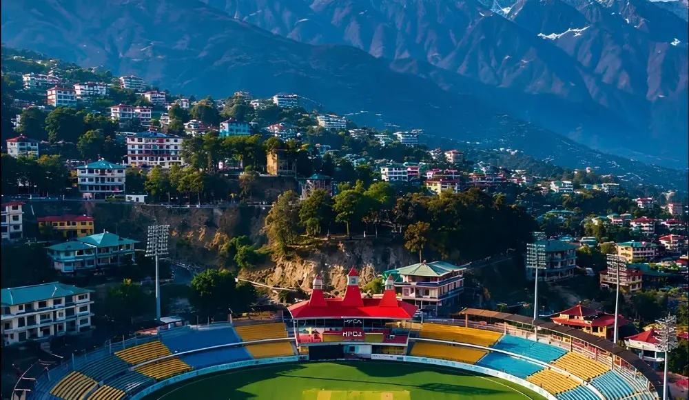 Shimla Manali Dharamshala package with mountain town, cricket stadium and snow covered Dhauladhar range views