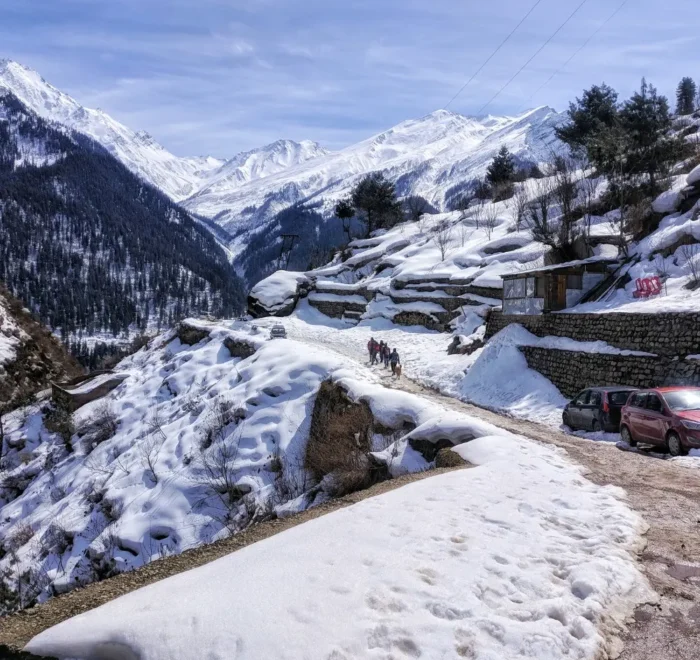 Shimla Manali package with snow covered mountains, scenic road, pine forest and beautiful Himachal winter landscape