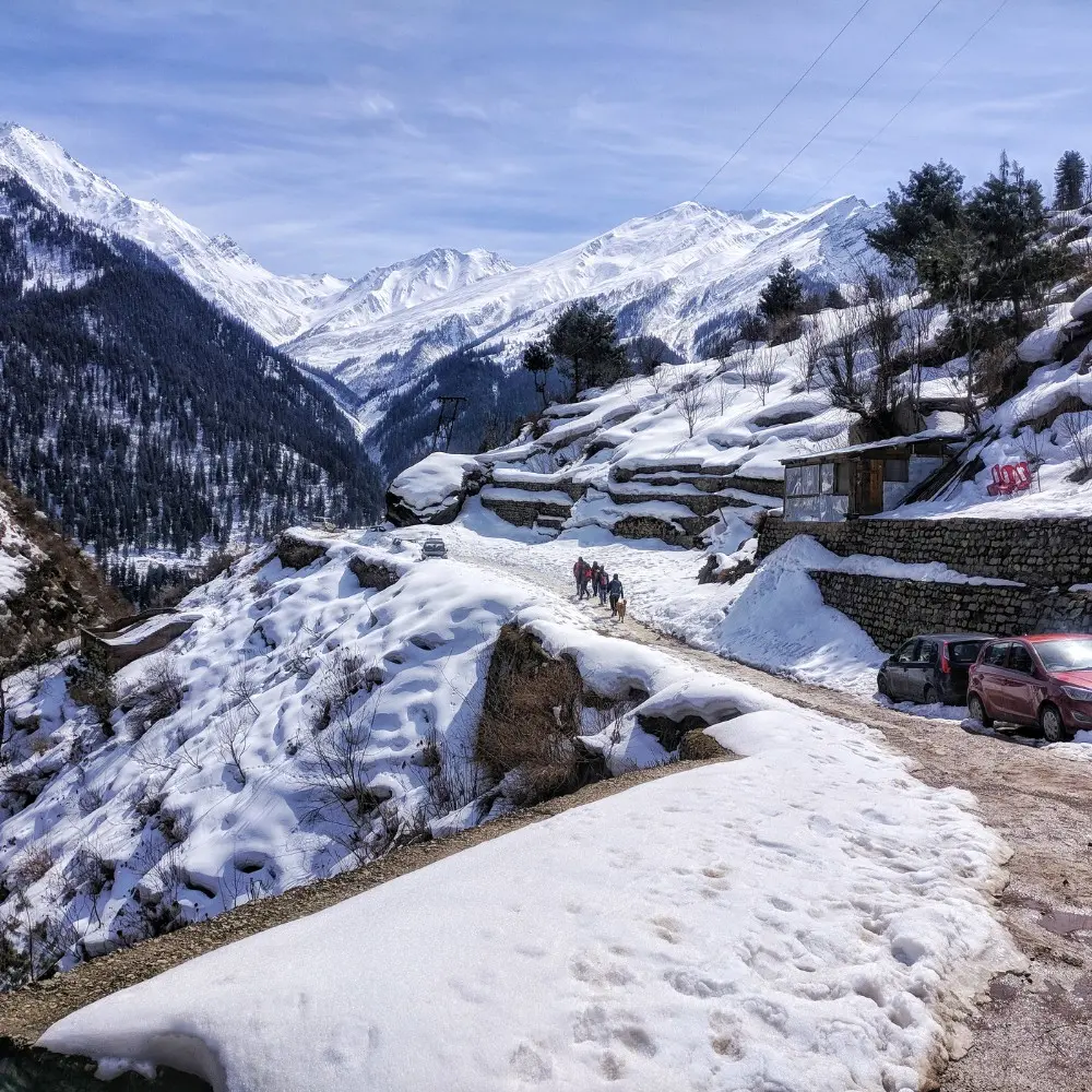 Shimla Manali package with snow covered mountains, scenic road, pine forest and beautiful Himachal winter landscape