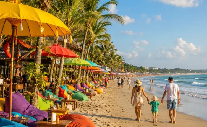 Seminyak Bali family beach tour with luxury resort pool, sandy beach, tropical palms, and bright morning atmosphere.
