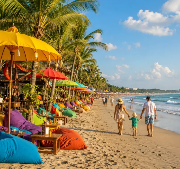 Seminyak Bali family beach tour with luxury resort pool, sandy beach, tropical palms, and bright morning atmosphere.