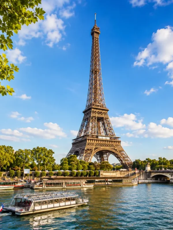 Eiffel Tower in Paris with elegant gardens, classic city views, clear sky, and bright morning European atmosphere.
