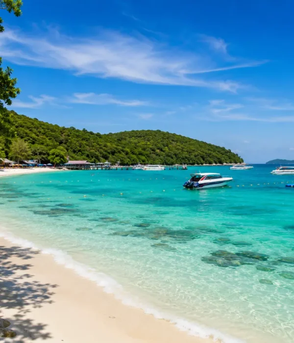 Pattaya Coral Island Thailand with turquoise sea, white sandy beach, speedboats, and bright morning tropical atmosphere.