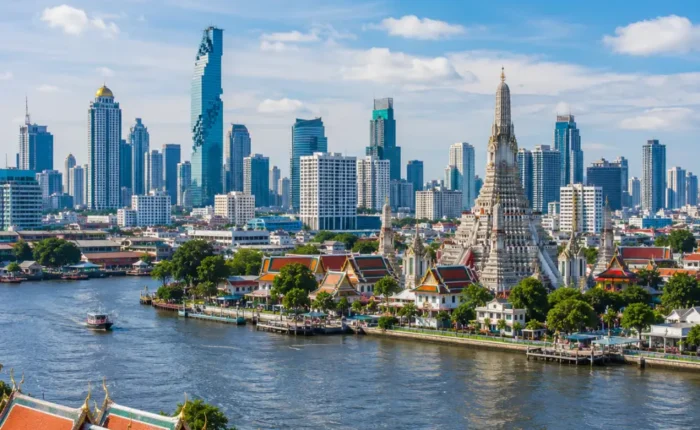 Bangkok city skyline with Grand Palace, Chao Phraya River, modern towers, and bright morning Thai atmosphere.