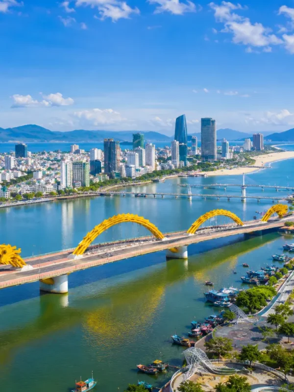 Da Nang Vietnam with Golden Bridge, lush Ba Na Hills scenery, and a bright premium luxury travel atmosphere.