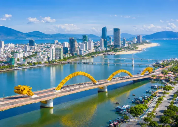 Da Nang Vietnam with Golden Bridge, lush Ba Na Hills scenery, and a bright premium luxury travel atmosphere.