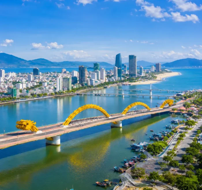 Da Nang Vietnam with Golden Bridge, lush Ba Na Hills scenery, and a bright premium luxury travel atmosphere.