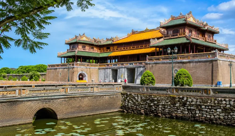 Hue Vietnam Imperial City with ancient royal architecture, lotus ponds, and a premium cultural travel atmosphere.