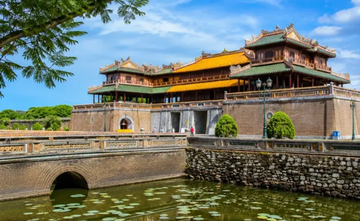 Hue Vietnam Imperial City with ancient royal architecture, lotus ponds, and a premium cultural travel atmosphere.