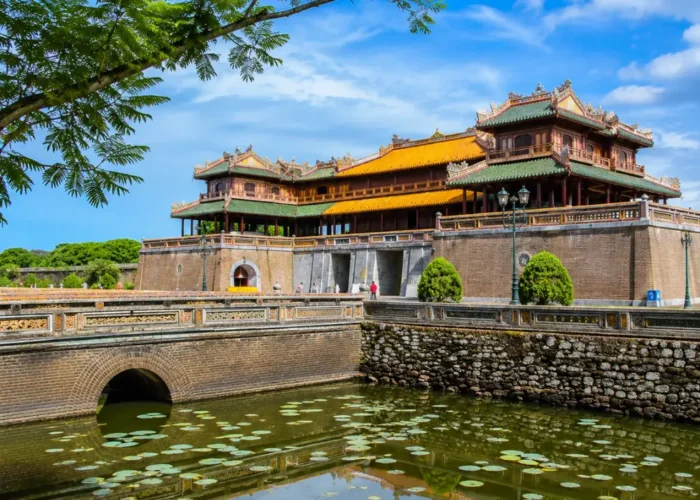 Hue Vietnam Imperial City with ancient royal architecture, lotus ponds, and a premium cultural travel atmosphere.