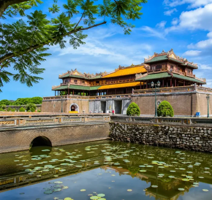Hue Vietnam Imperial City with ancient royal architecture, lotus ponds, and a premium cultural travel atmosphere.
