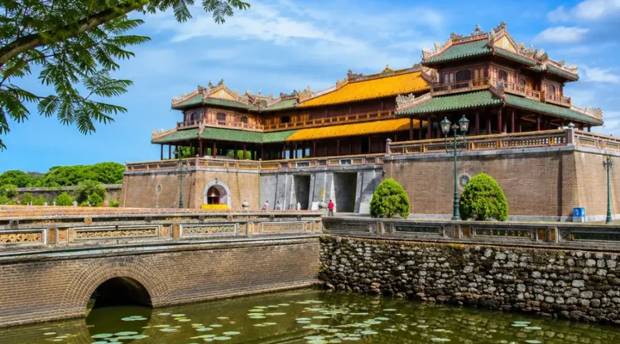 Hue Vietnam Imperial City with ancient royal architecture, lotus ponds, and a premium cultural travel atmosphere.