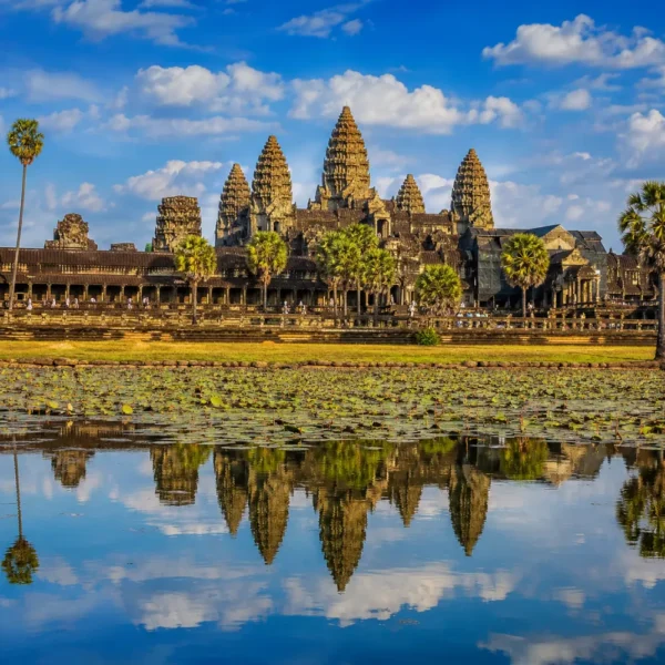 Siem Reap Cambodia with Angkor Wat temple, lotus ponds, ancient stone architecture, and a premium cultural travel atmosphere.