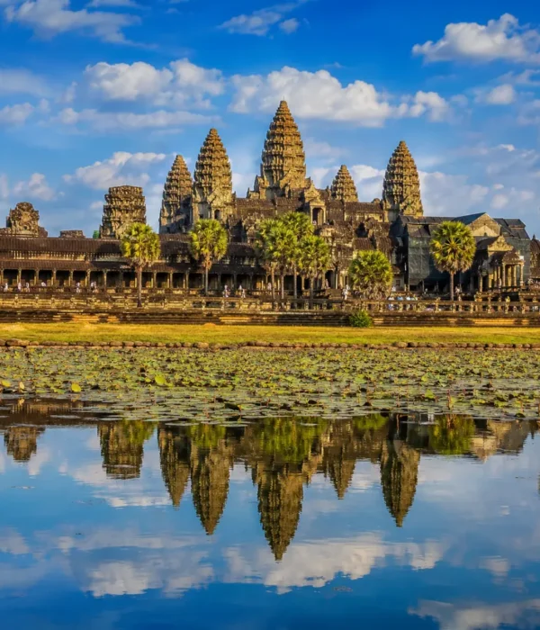 Siem Reap Cambodia with Angkor Wat temple, lotus ponds, ancient stone architecture, and a premium cultural travel atmosphere.