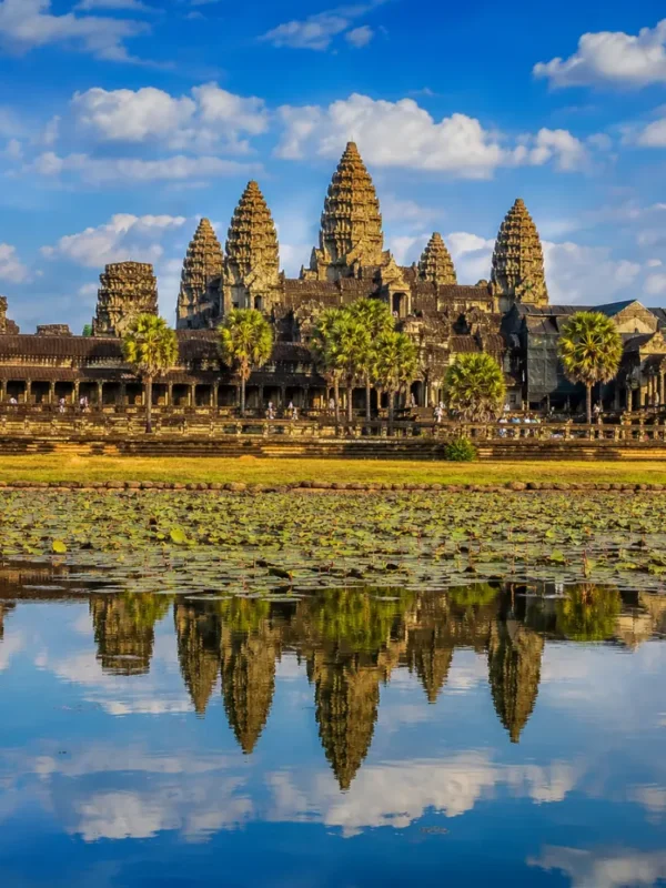 Siem Reap Cambodia with Angkor Wat temple, lotus ponds, ancient stone architecture, and a premium cultural travel atmosphere.