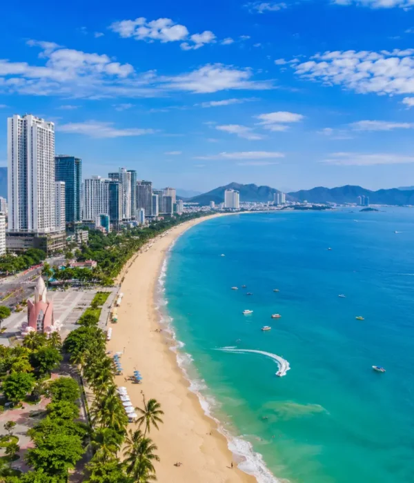 Nha Trang Vietnam beach with turquoise sea, modern coastline, tropical islands, and a premium luxury travel atmosphere