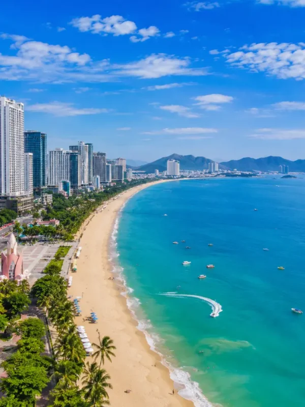 Nha Trang Vietnam beach with turquoise sea, modern coastline, tropical islands, and a premium luxury travel atmosphere