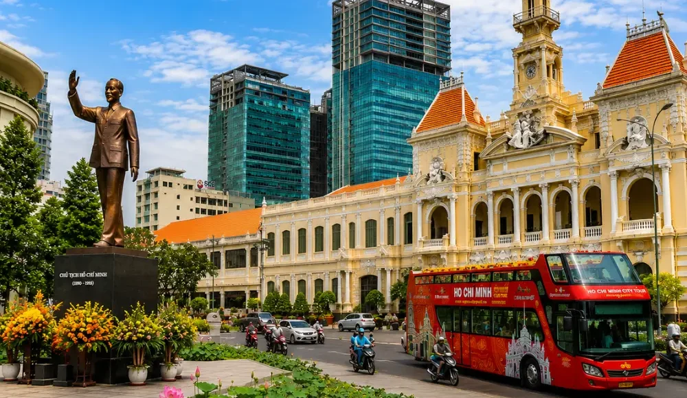 Ho Chi Minh City tour with City Hall, Ho Chi Minh statue, lotus garden, sightseeing bus, and modern Saigon skyline.