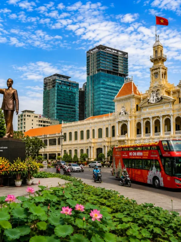 Ho Chi Minh City tour with City Hall, Ho Chi Minh statue, lotus garden, sightseeing bus, and modern Saigon skyline.