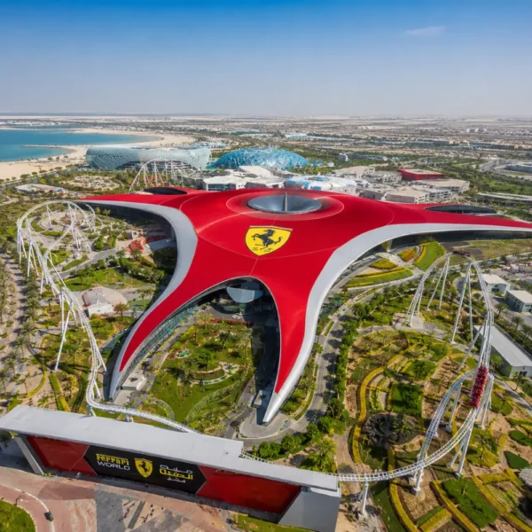 Yas Island Ferrari World Abu Dhabi with red Ferrari-inspired architecture, luxury theme park entrance, and premium UAE travel atmosphere.