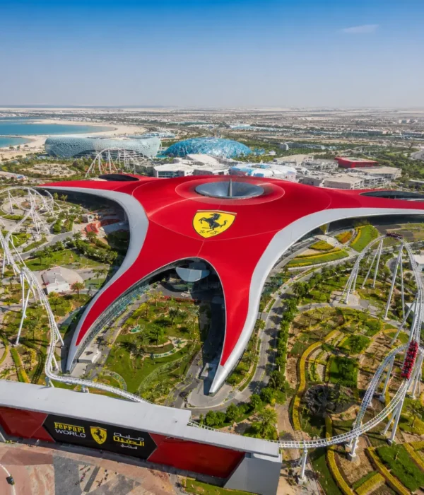 Yas Island Ferrari World Abu Dhabi with red Ferrari-inspired architecture, luxury theme park entrance, and premium UAE travel atmosphere.