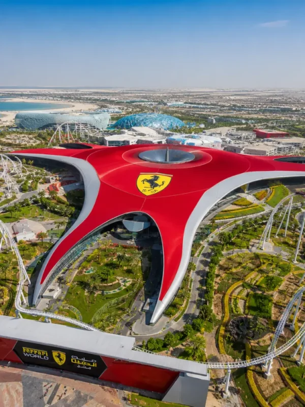 Yas Island Ferrari World Abu Dhabi with red Ferrari-inspired architecture, luxury theme park entrance, and premium UAE travel atmosphere.