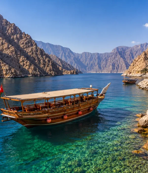 Oman Musandam cruise with traditional dhow boat, turquoise fjord waters, rocky cliffs, and a premium Arabian sea tour atmosphere.