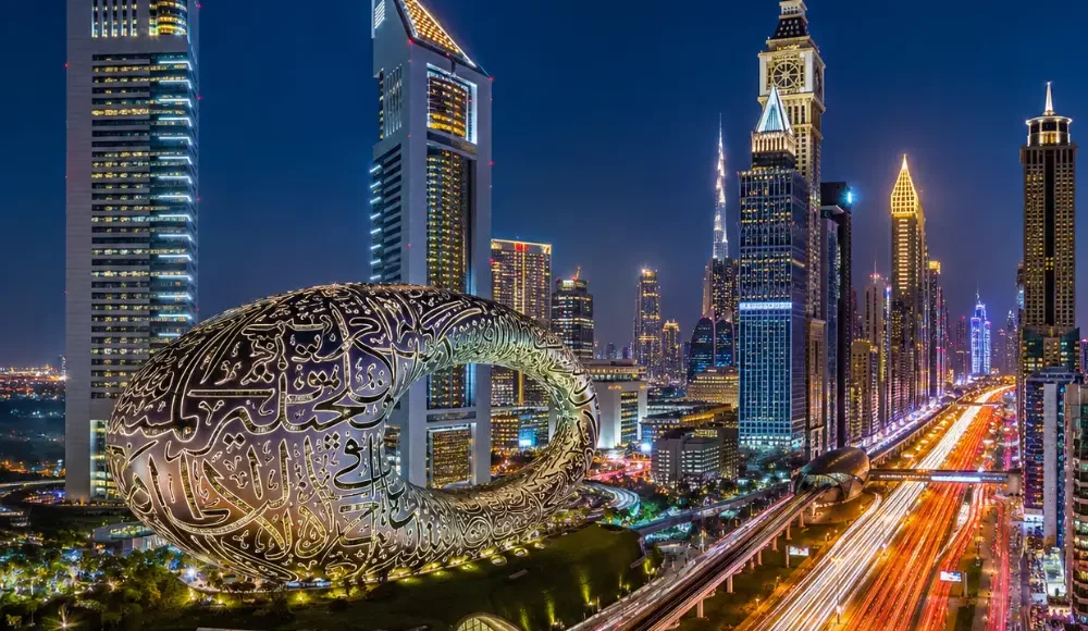 Dubai night skyline with Museum of the Future, glowing city lights, futuristic towers, and a premium luxury travel atmosphere.