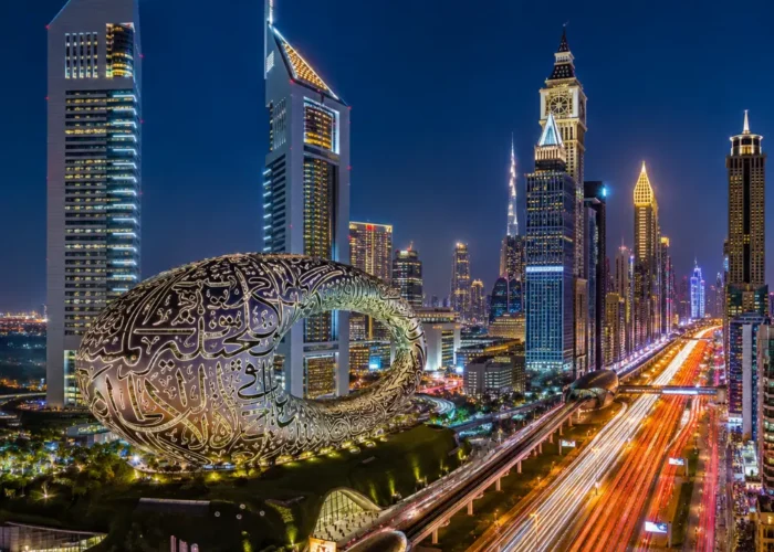 Dubai night skyline with Museum of the Future, glowing city lights, futuristic towers, and a premium luxury travel atmosphere.