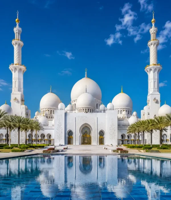 Sheikh Zayed Grand Mosque in Abu Dhabi with white marble domes, grand minarets, reflective pools, and a premium cultural travel atmosphere.