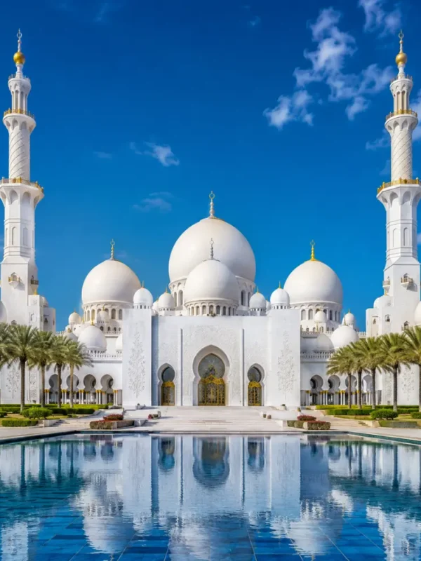 Sheikh Zayed Grand Mosque in Abu Dhabi with white marble domes, grand minarets, reflective pools, and a premium cultural travel atmosphere.