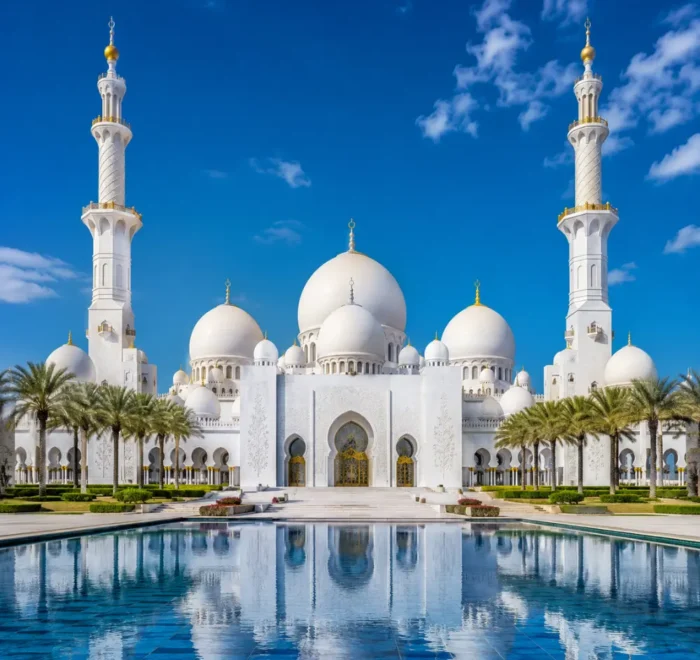 Sheikh Zayed Grand Mosque in Abu Dhabi with white marble domes, grand minarets, reflective pools, and a premium cultural travel atmosphere.