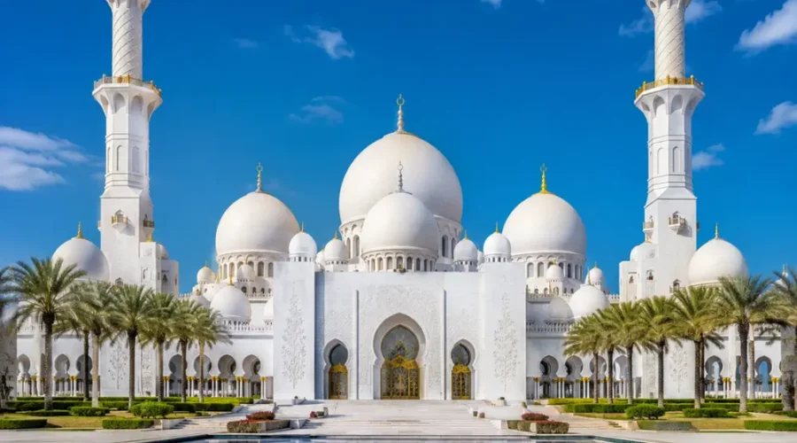 Sheikh Zayed Grand Mosque in Abu Dhabi with white marble domes, grand minarets, reflective pools, and a premium cultural travel atmosphere.