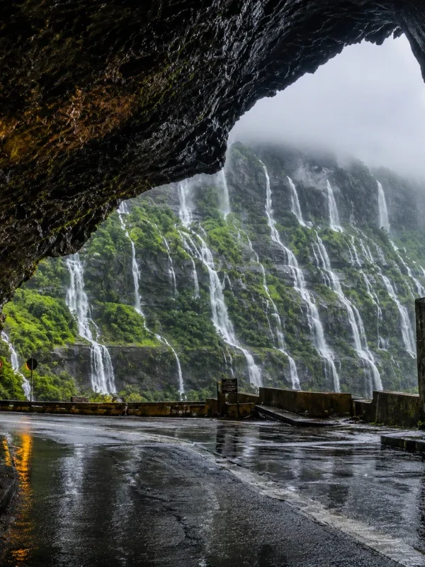 Malshej Ghat monsoon tour featuring mist-covered Sahyadri hills, lush green valleys and cascading seasonal waterfalls