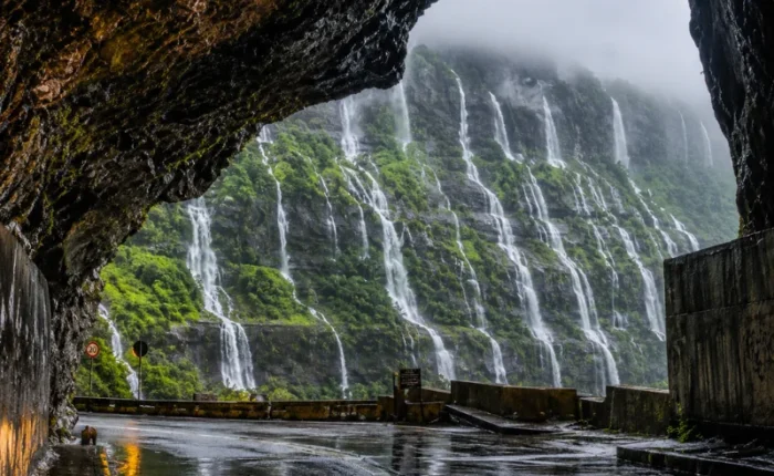 Malshej Ghat monsoon tour featuring mist-covered Sahyadri hills, lush green valleys and cascading seasonal waterfalls