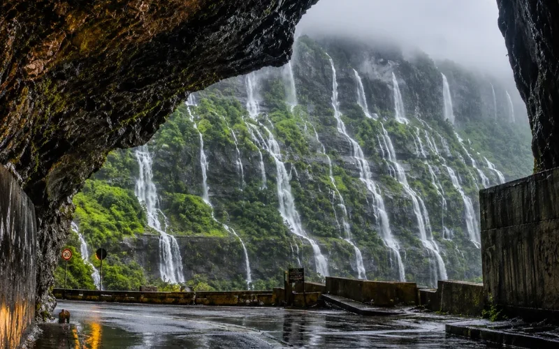 Malshej Ghat monsoon tour featuring mist-covered Sahyadri hills, lush green valleys and cascading seasonal waterfalls