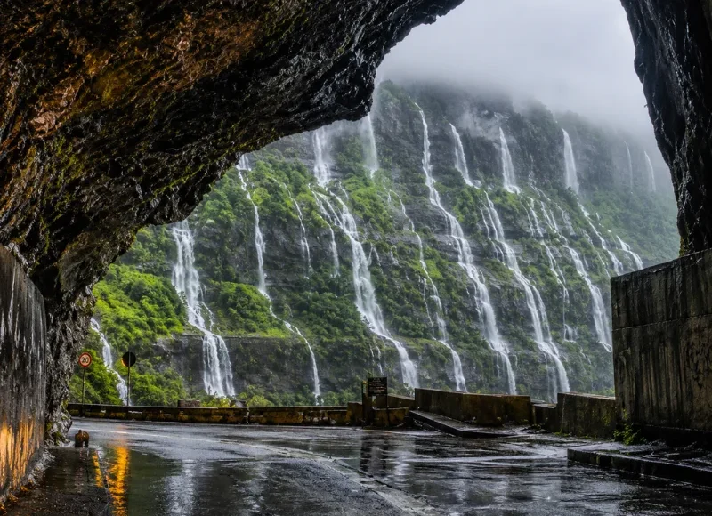Malshej Ghat monsoon tour featuring mist-covered Sahyadri hills, lush green valleys and cascading seasonal waterfalls
