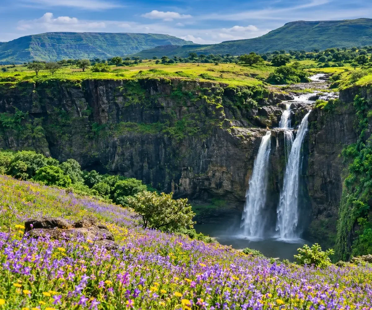 Satara Kaas Plateau Thoseghar Tour Package featuring Kaas Plateau, Thoseghar Waterfalls, Kaas Lake, Sajjangad Fort and the scenic Sahyadri hills.